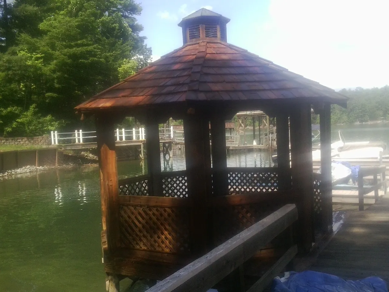 Cedar shake gazebo roof rebuilt on a lake dock in Cook Springs